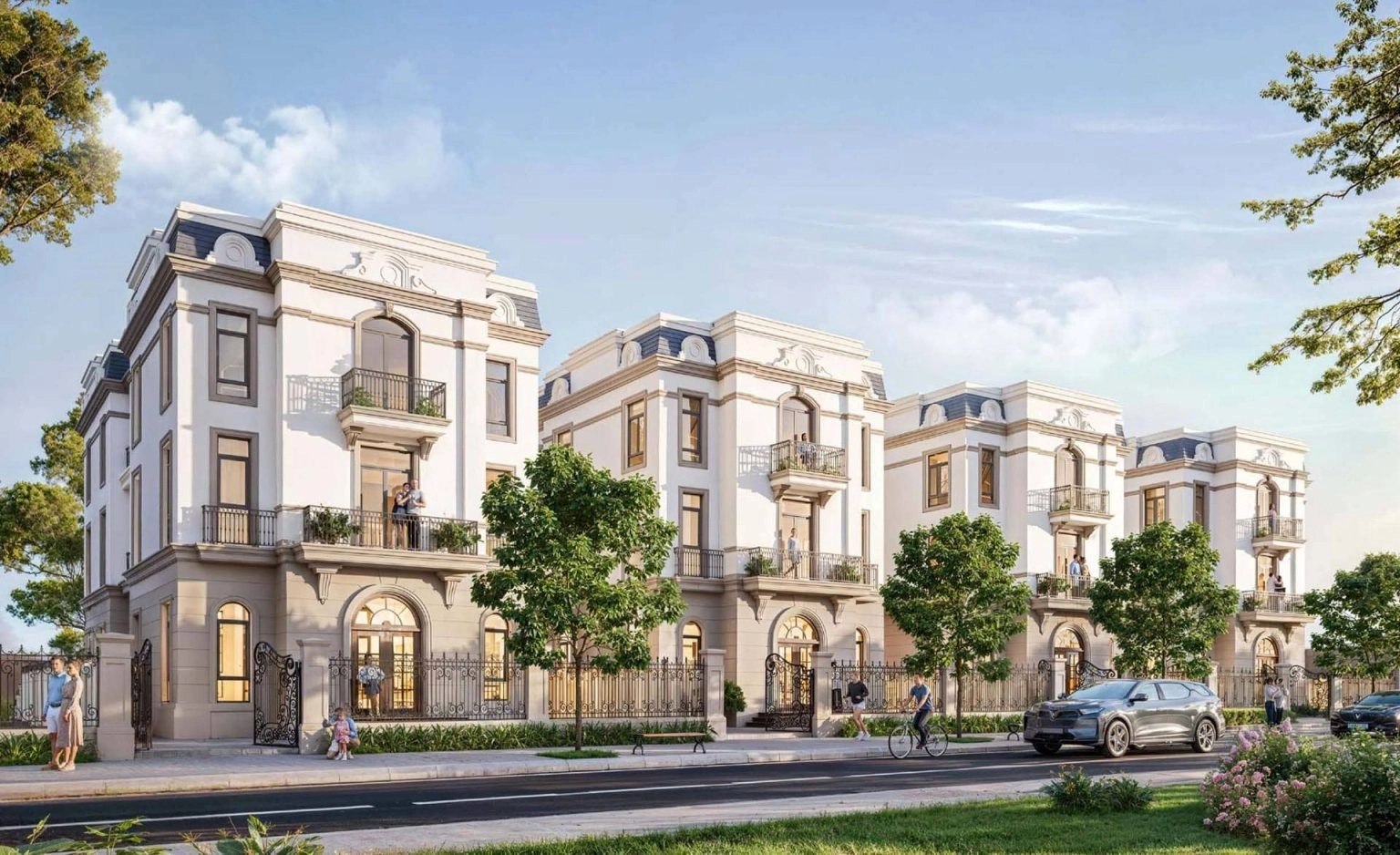 Dãy nhà biệt thự liền kề phong cách tân cổ điển sang trọng bên đường nội khu với cây xanh và người đi bộ.