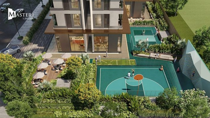Sân thể thao ngoài trời với sân bóng rổ và sân tennis hiện đại, nằm cạnh tòa nhà căn hộ tại Masteri Lakeside